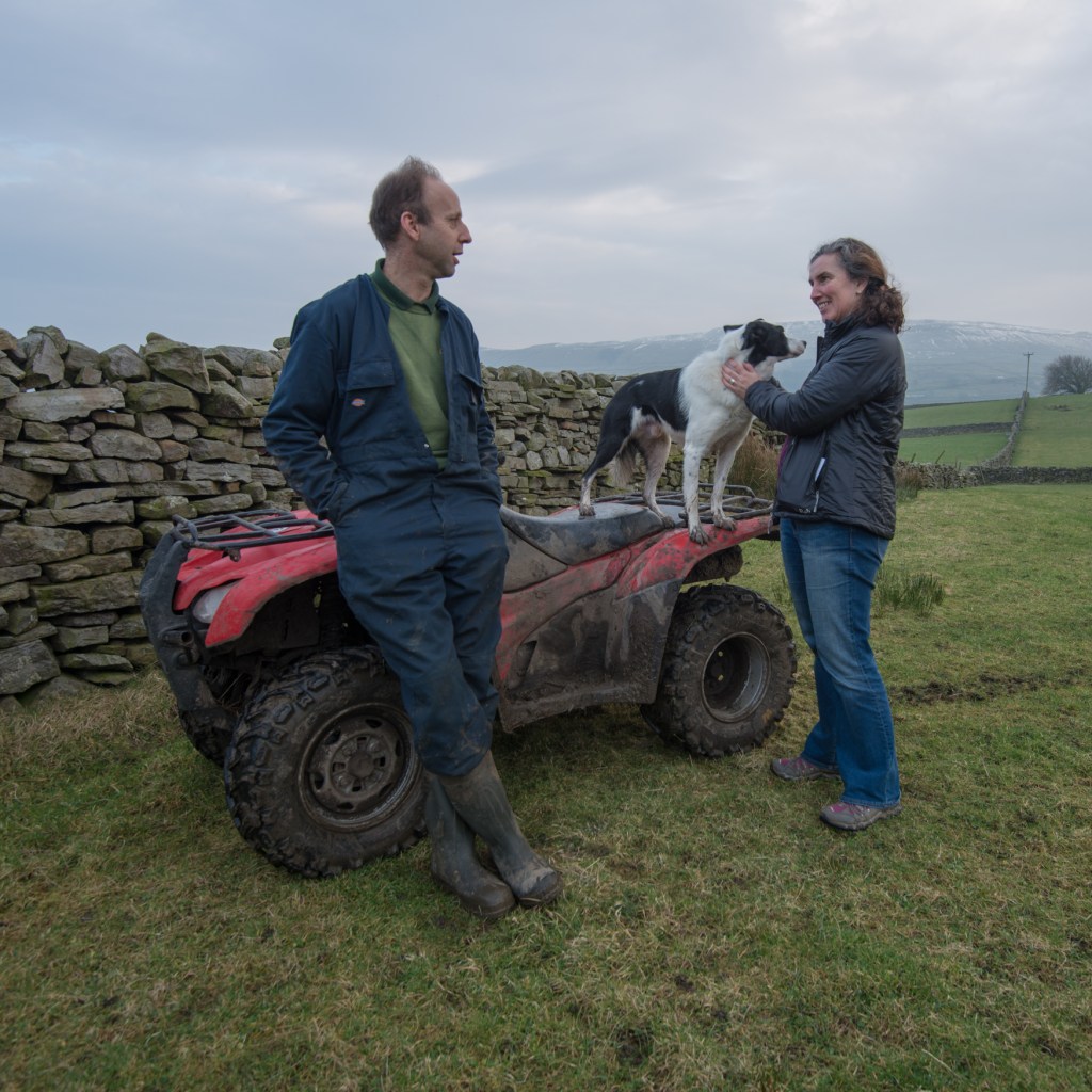Harriet getting friendly with Bob the dog whilst chatting to Ant Heseltine on his farmland on the edge of Hawes.